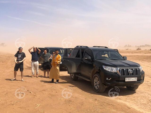desert with 4x4 and driver